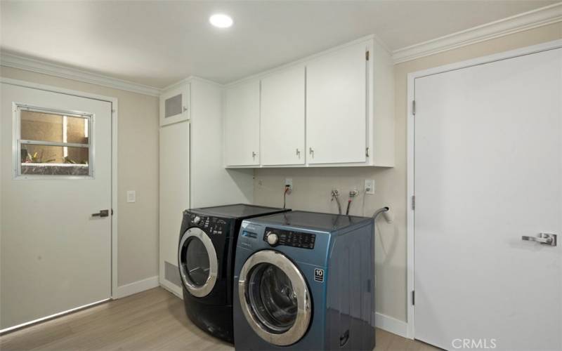 The inside Laundry room is just off the family room/kitchen. Door to garage is on right.