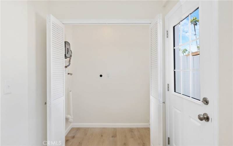 Laundry Area with tankless water heater