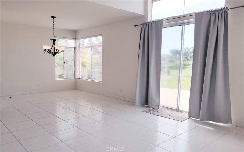 DINING ELL, TALL GLASS SLIDER DOORS TO PATIO, LAWN & GOLF COURSE