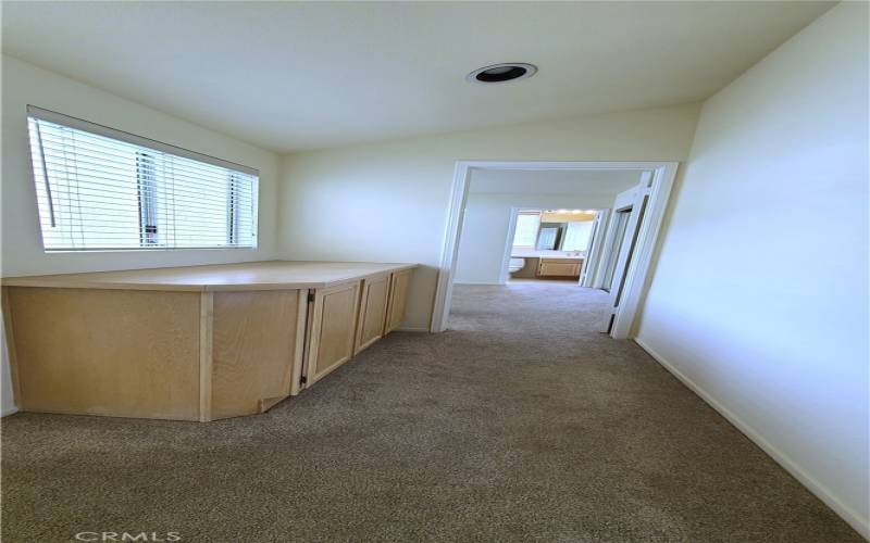 UPSTAIRS HALL W/ WINDOW & CABINETRY