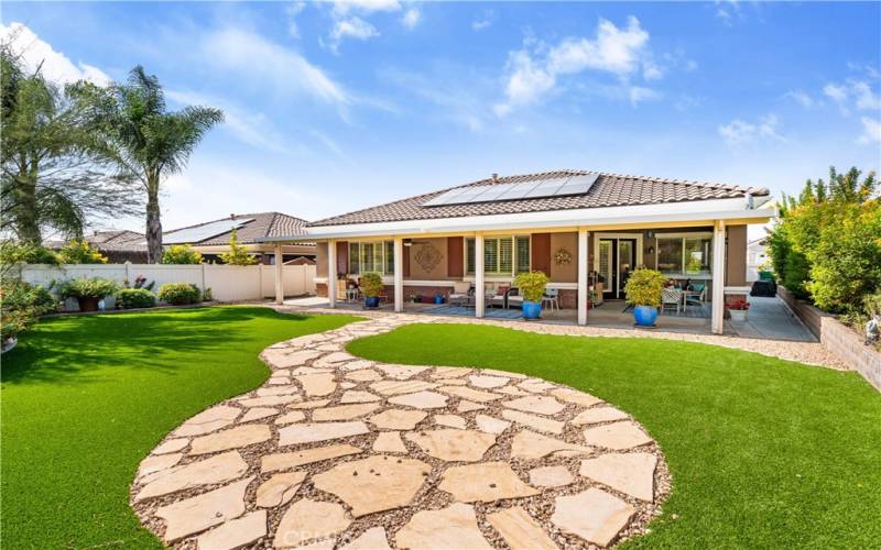 Back of House and Stone Pathway leading to a perfect area for more seating