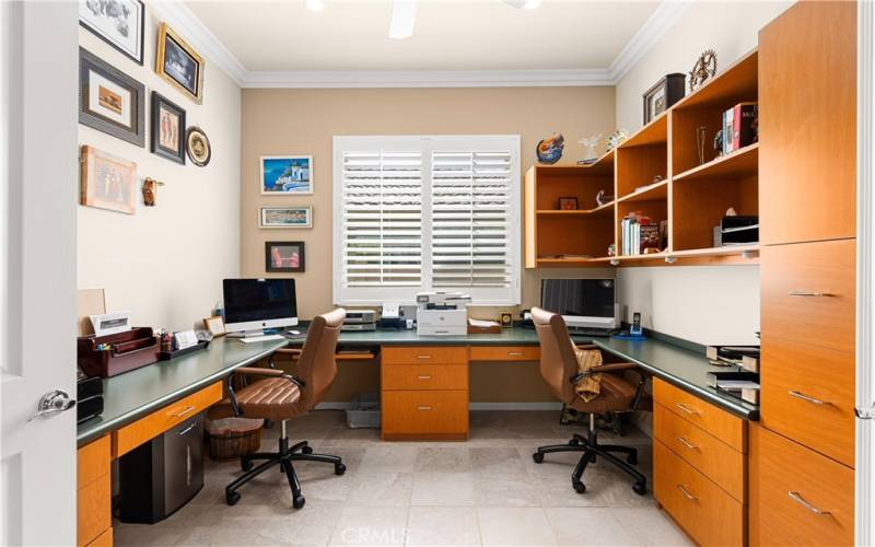 Double Door entrance to Den/Office with Built-in Desks, Cabinets and Shelving