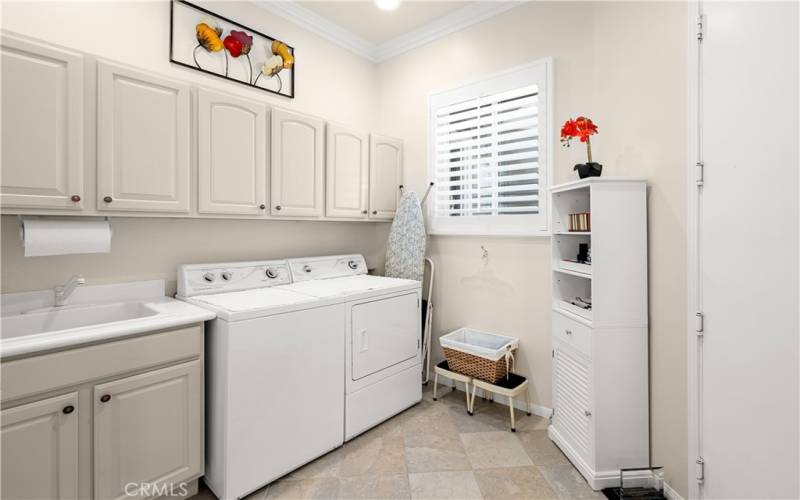 Laundry Room with Sink and Storage Cabinets. Large Pantry is in Laundry Rm which is off the Kitchen.