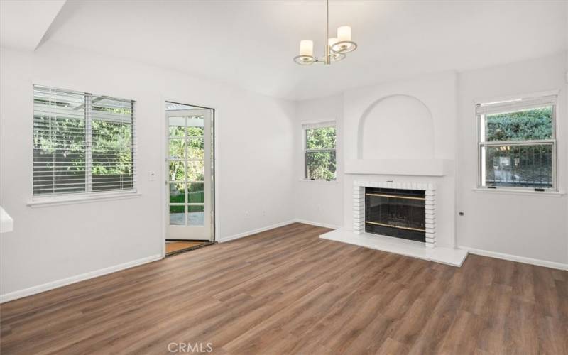 Family room with French door to garden, and wood burning fireplace*