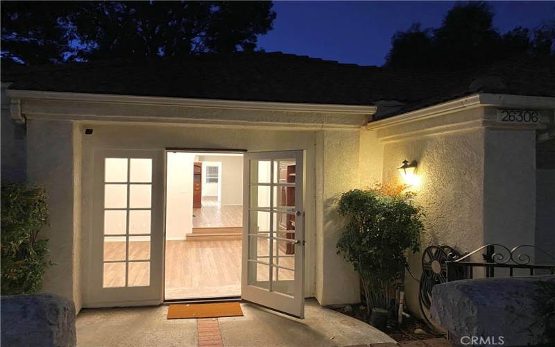 Front courtyard view through house.  From living, to dining, to kitchen, to family spaces.