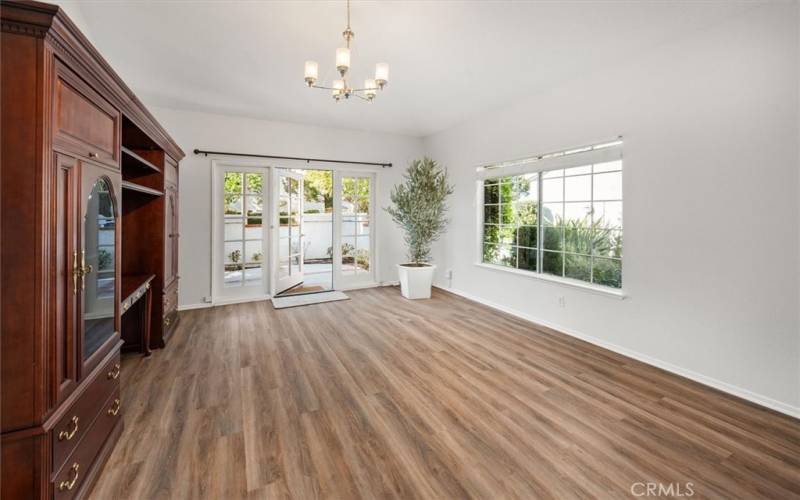 Front living room with french doors out to forward walled patio