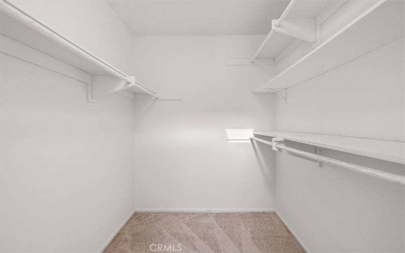 Primary bedroom walk-in closet