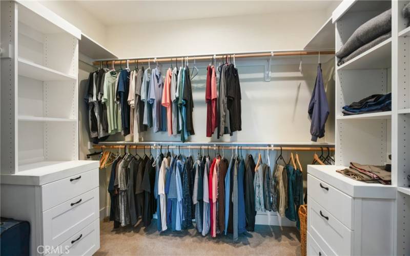 Amazing walk-in closet with built-in shelves and drawers...