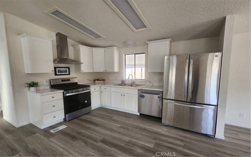 Updated Open Kitchen with New Cabinets and Stainless Appliances