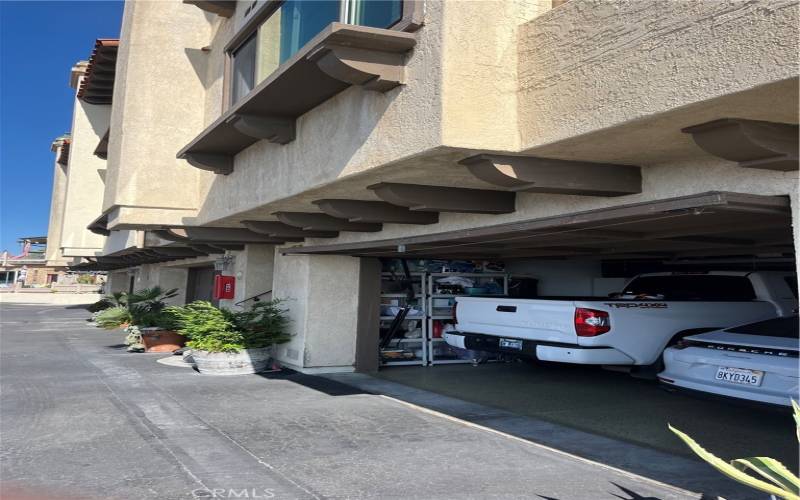 Full 2 car garage with epoxy flooring and lots of storage