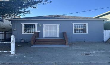 Charming 2 bedroom 1 bath Bungalow. With a Bonus room. Kitchen nook, Back yard. Needs care and Love.