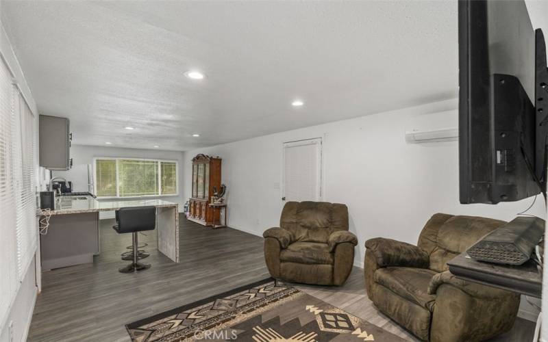 Living room opens to kitchen