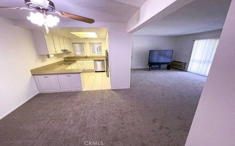 Dining Area toward Kitchen with new Cooktop, Dishwasher, Refrigerator, fixtures