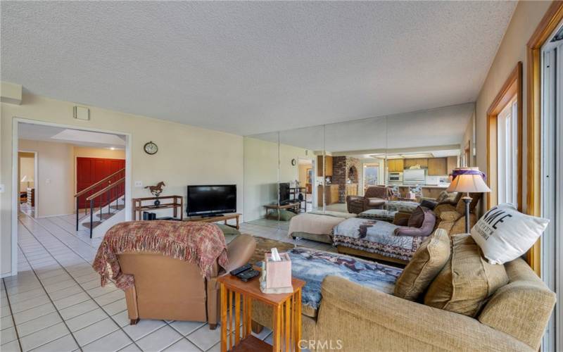 Family room has mirrored wall.