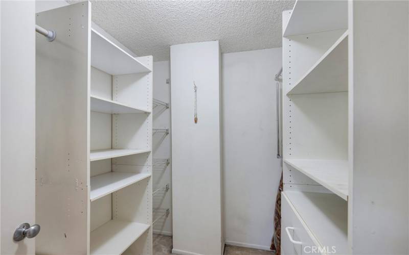 Main bedroom has a walk in closet with organizers.