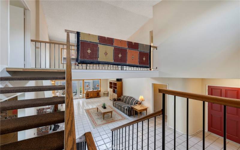 View of living room from landing of stairs.