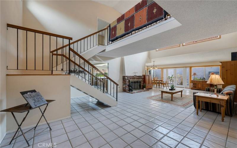 View of living room with fireplace from entry.