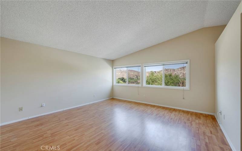 Main bedroom has cathedral ceilings.