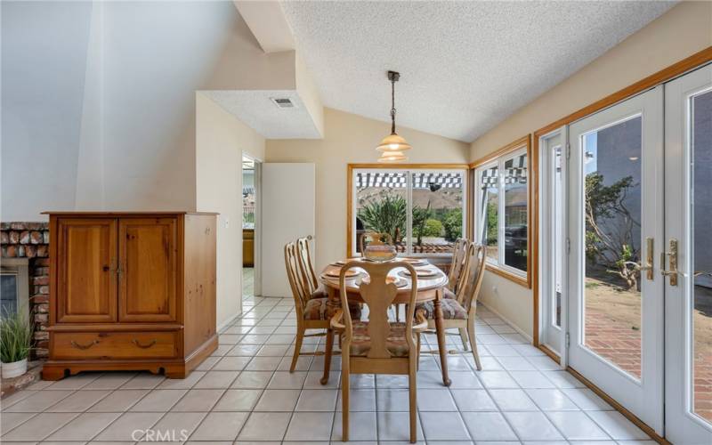 Dining room has view & access to side & back yard.