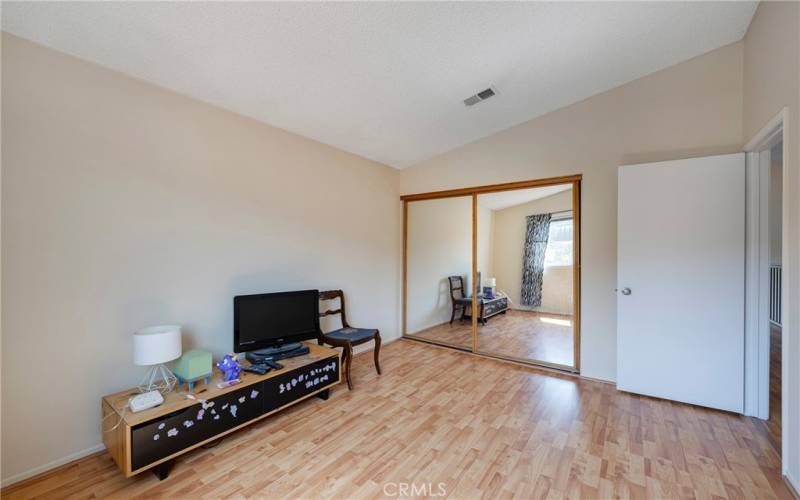 2nd secondary bedroom has mirrored closet doors.