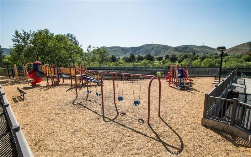 Gated children’s playground near association clubhouse.