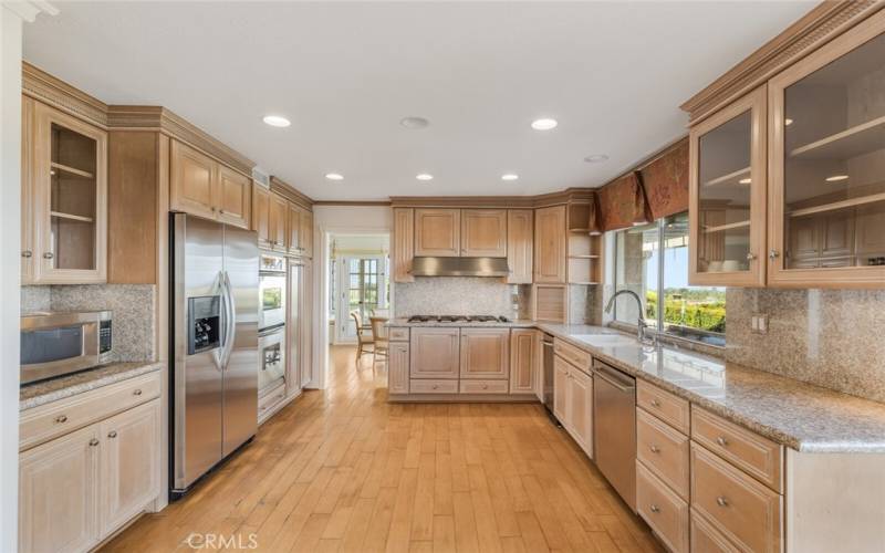 There is a 5 burner gas cooktop and ample counter space in this kitchen!