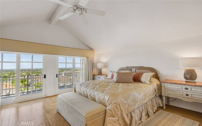 Upstairs main bedroom that opens to a balcony.