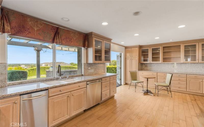 Kitchen featuring updated cabinets and granite countertops