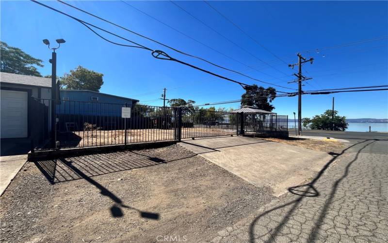 Fenced storage lot with driveway.