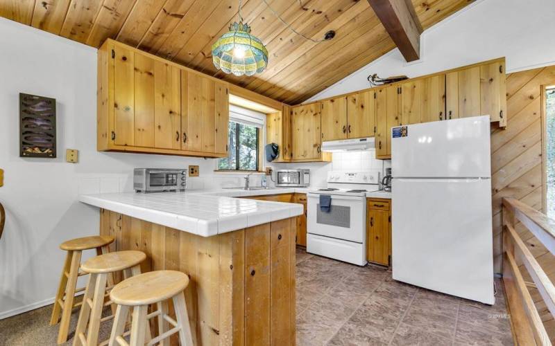 15 Open kitchen with bar stool seating