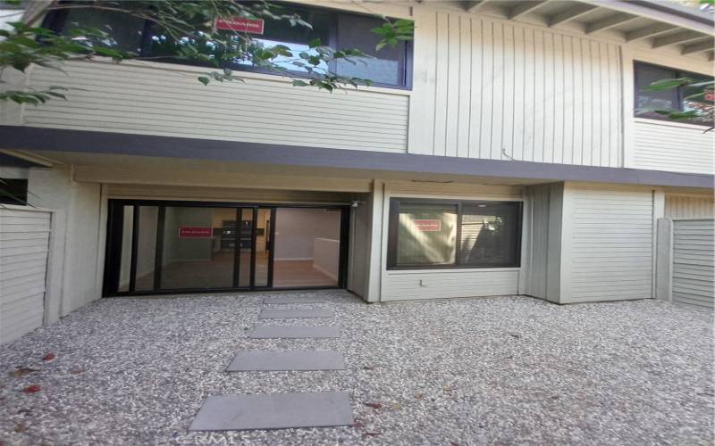 Private courtyard seen from garage - BRs above