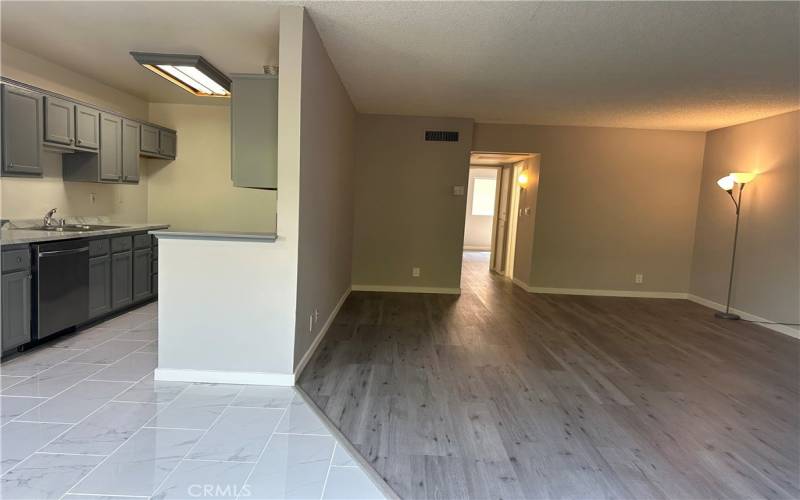 Galley kitchen adjacent to living room.