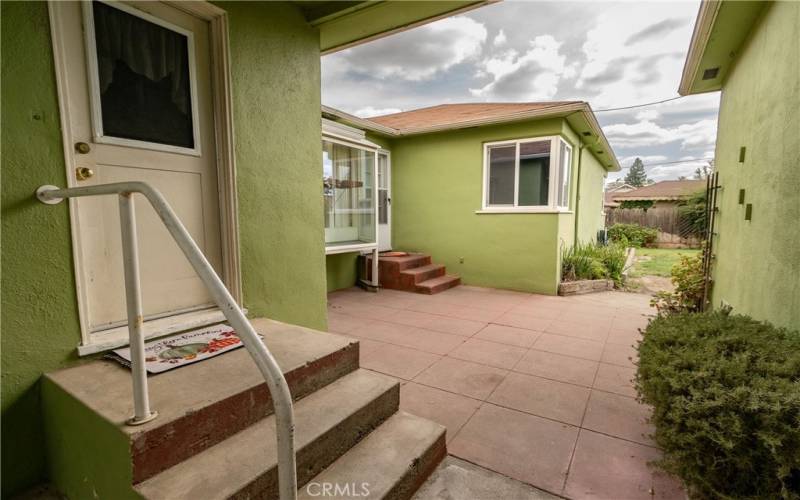 Back steps/patio covered & gated to garage