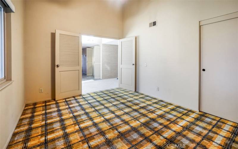 The first bedroom looking out to the entrance way.