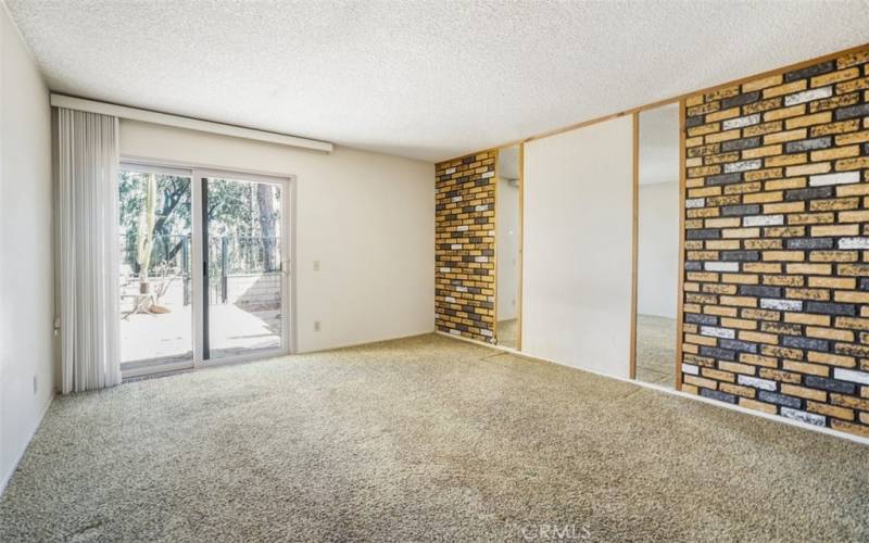 Third Bedroom with a slider access to the back patio.