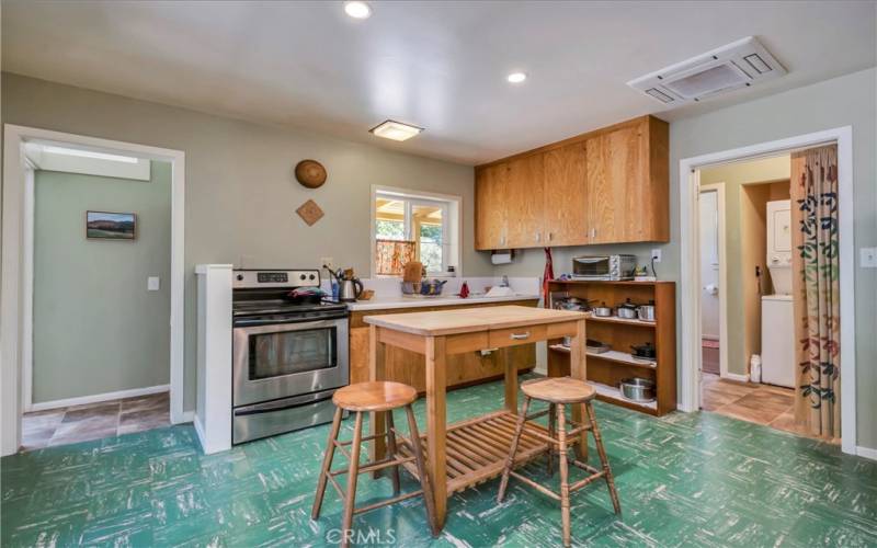 Dining Kitchen door way at right to spacious bedroom, full bath, laundry area and 2nd exit to backyard