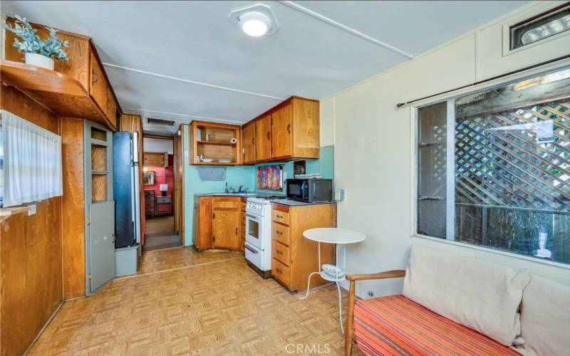 Guest trailer on property, living area looking towards kitchen area and back bedroom