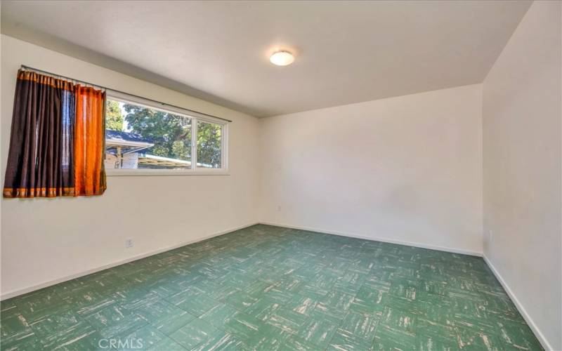 Largest bedroom with closet, lino flooring next to 2nd bathroom