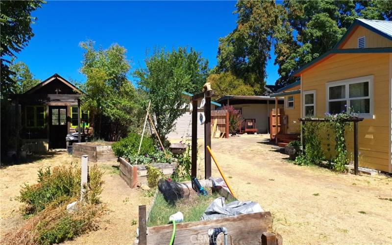 Backyard, garden shed, back porch, photo taken by owner