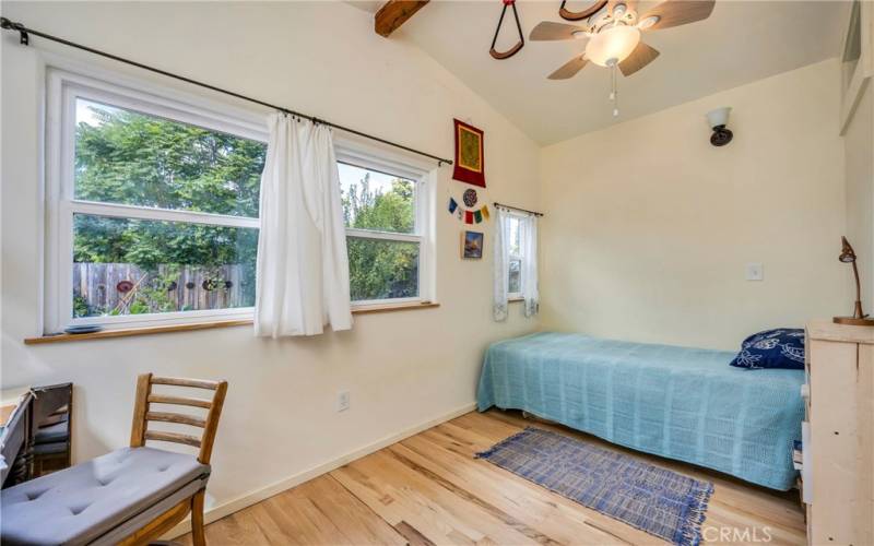 Cozy sunfilled back bedroom