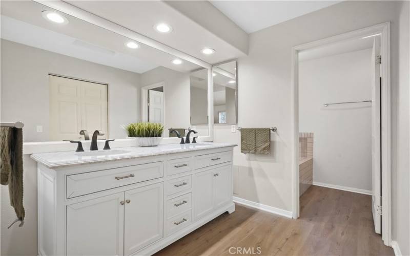 Spa like attached primary suite bathroom. There is a big walk in closet adjacent to the vanity