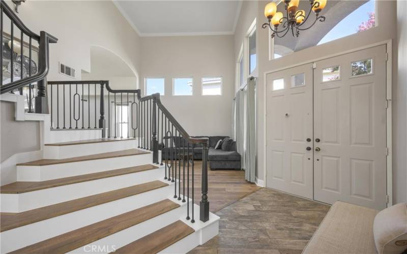 Grand Staircase, high ceilings in formal Living room and Dining room