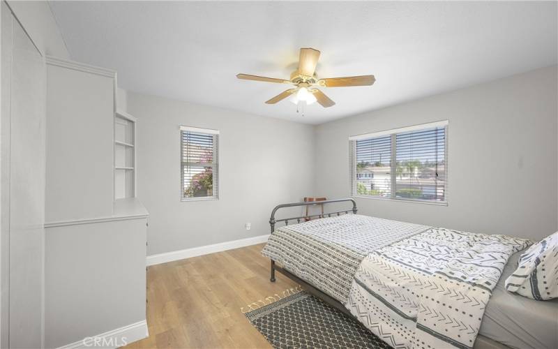 Bedroom #5 with build in shelves by the closet.