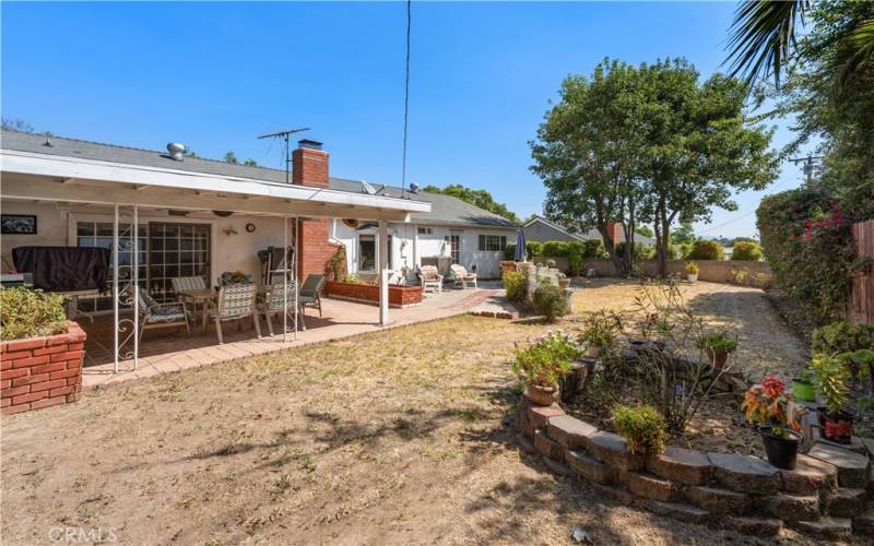 This yard has plenty of room for entertaining and gardening!