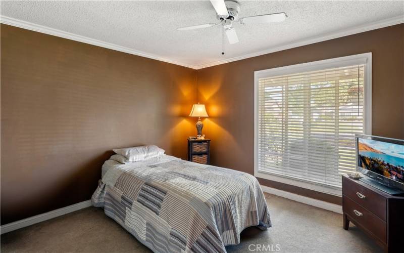 Bedroom #1 with ceiling fan, crown molding and lovely window blinds!