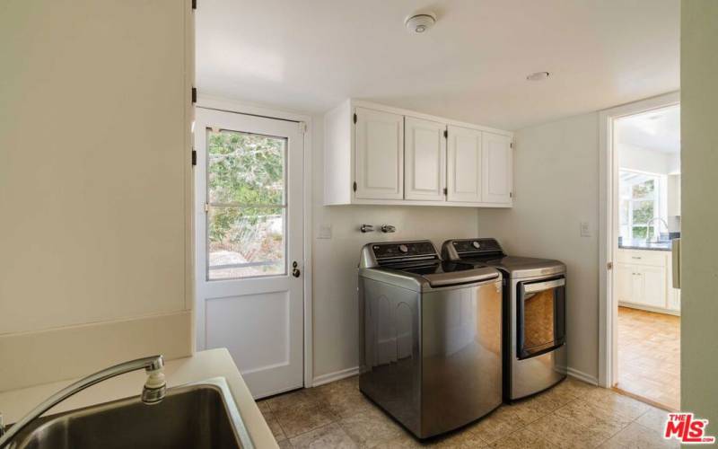 Laundry Room off of Kitchen + Garage