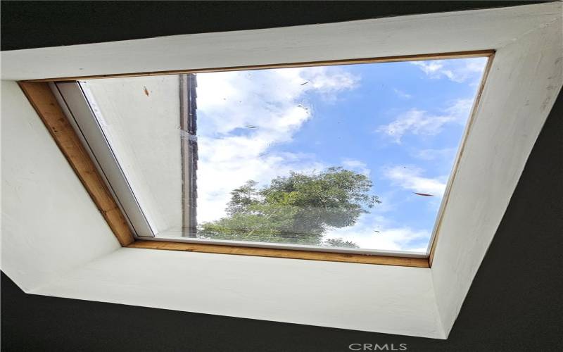 Skylight with shade partially open.