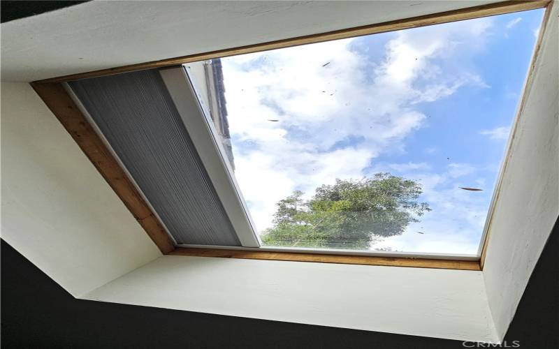 Skylight with shade partially open.