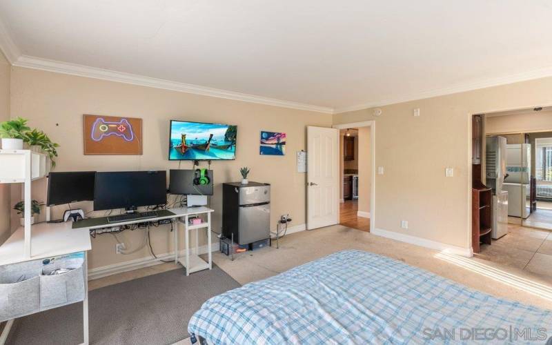 Large Primary bedroom with pool views.