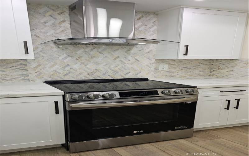 Next-Gen Electric Range and Oven with Stove Vent Hood That Looks More Like Art than an Appliance